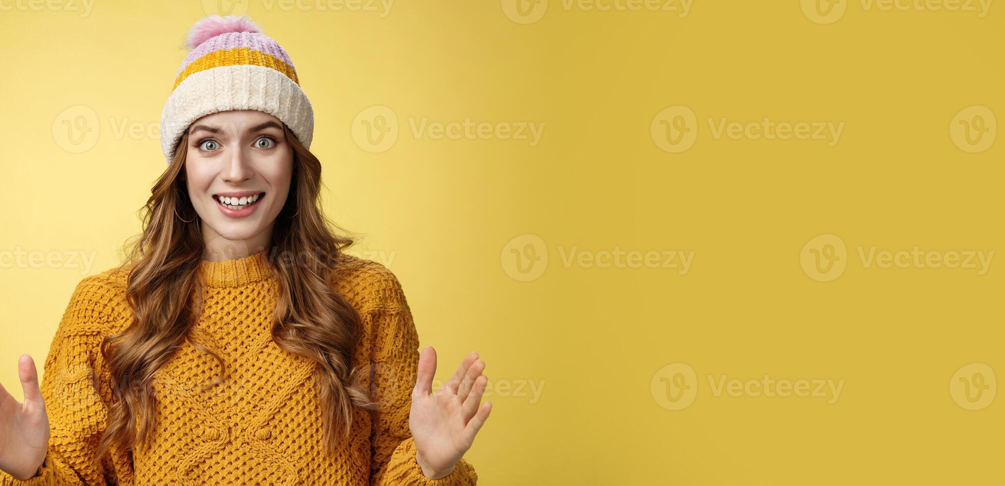 Amazed excited attractive young 20s girl describing large awesome product show big box shape smiling astonished standing thrilled impressed incredible merch, standing yellow background photo
