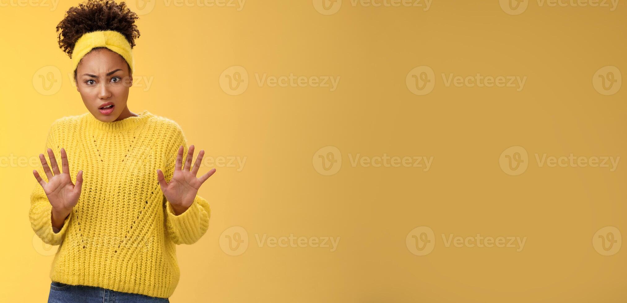 Arrogant ignorant disappointed reluctant fashionable popular african american girl university student reject awful offer raise hands stop enough refusal rejection gesture look shocked offended photo