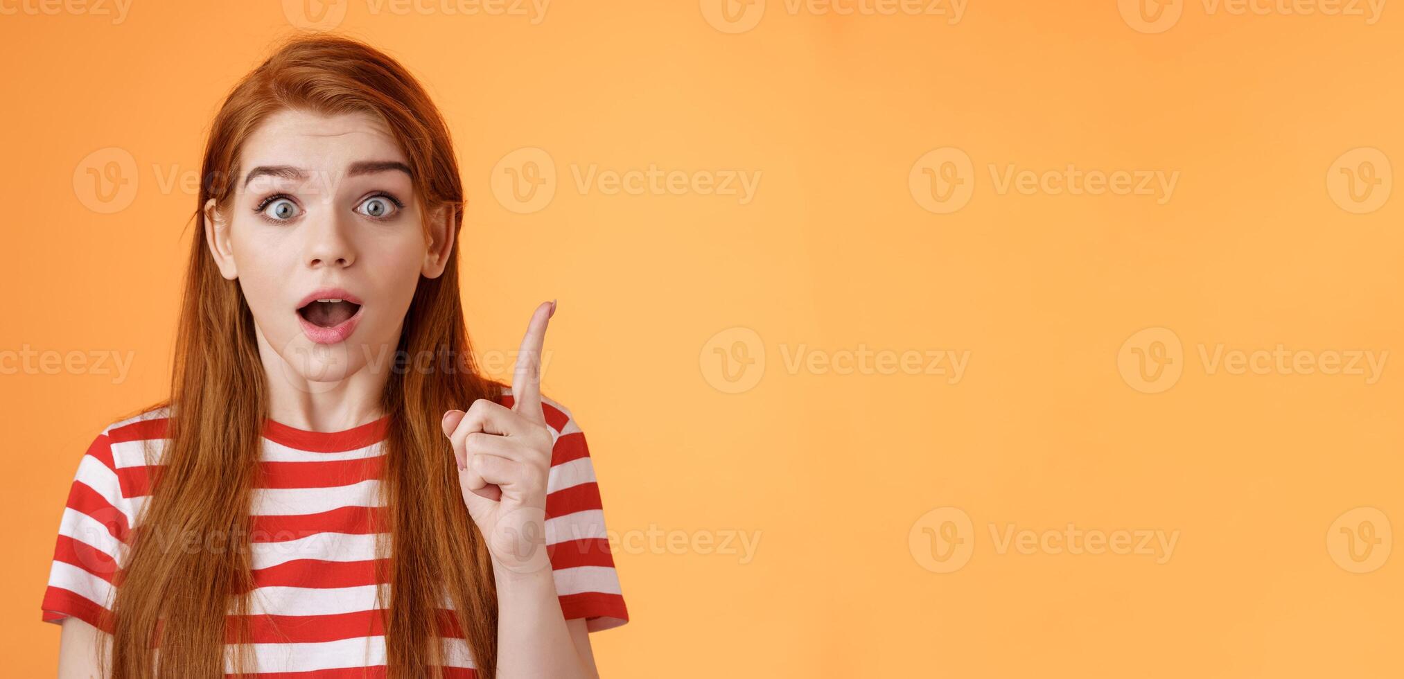 Got idea. Excited redhead woman sharing interesting plan, raise index finger eureka gesture, open mouth say thought, remember important thing, stare camera stunned, finally understand photo