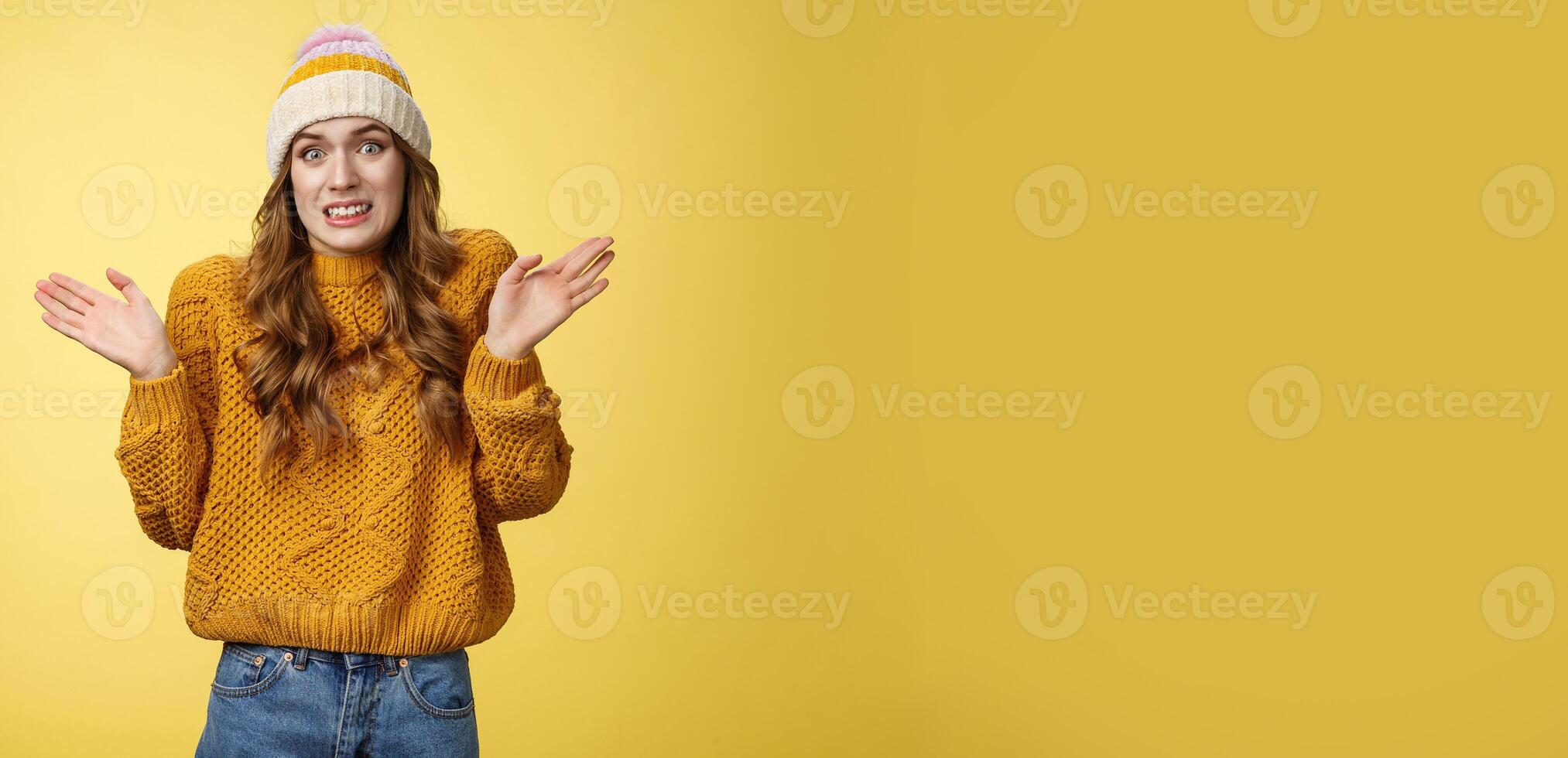 Oops sorry, my fault. Portrait awkward insecure worried cute european 20s girl apologizing making mistake disturbing friend bad temper raising hands surrender cringing confused shrugging photo