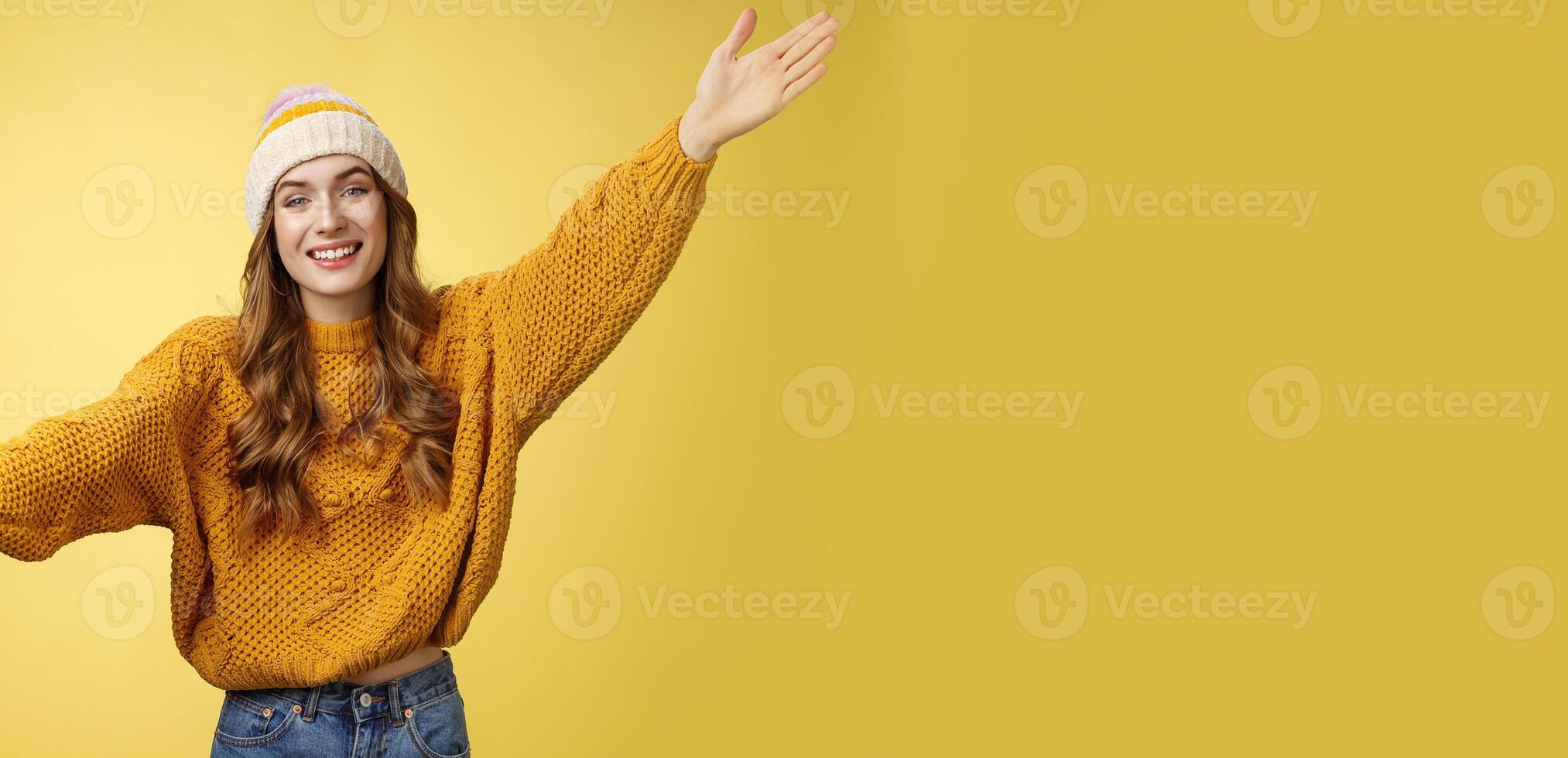 Friendly happy charming smiling cute girl inviting friends joyfully spread hands embracing wanna hug cuddle dear guest grinning cheerful, having fun expressing postivity good mood photo