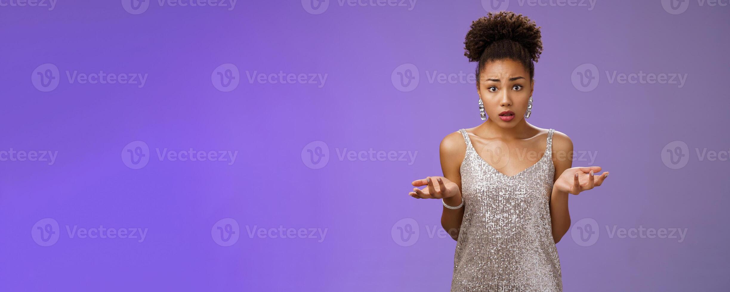 Concerned frustrated and confused attractive african-american curly-haired girl cannot understant what happening raise hands clueless dismay look questioned silly asking what did wrong photo