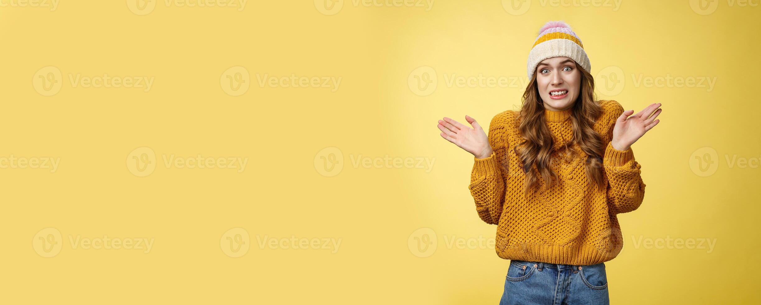Oops sorry, my fault. Portrait awkward insecure worried cute european 20s girl apologizing making mistake disturbing friend bad temper raising hands surrender cringing confused shrugging photo