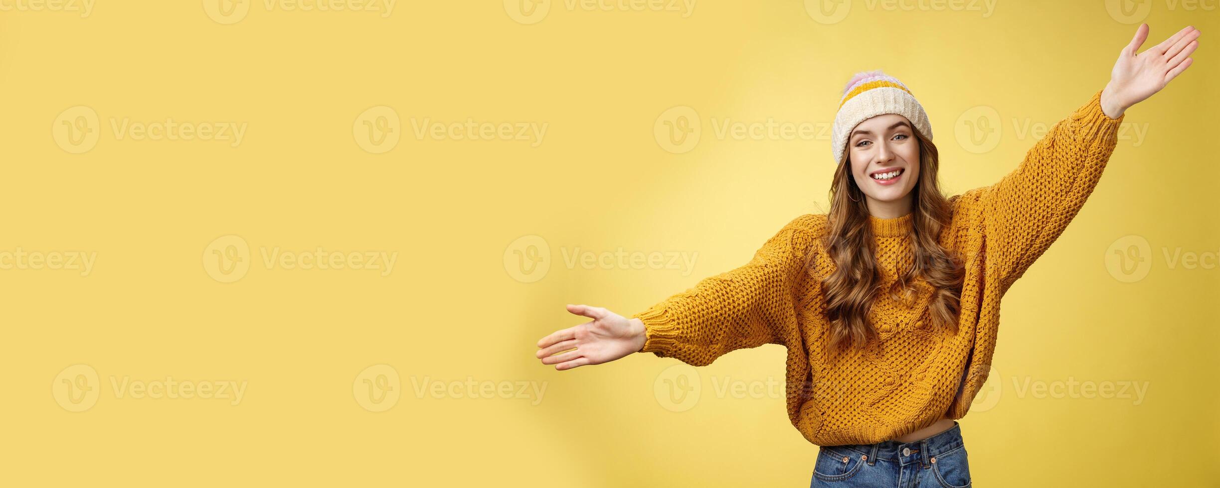 Friendly happy charming smiling cute girl inviting friends joyfully spread hands embracing wanna hug cuddle dear guest grinning cheerful, having fun expressing postivity good mood photo