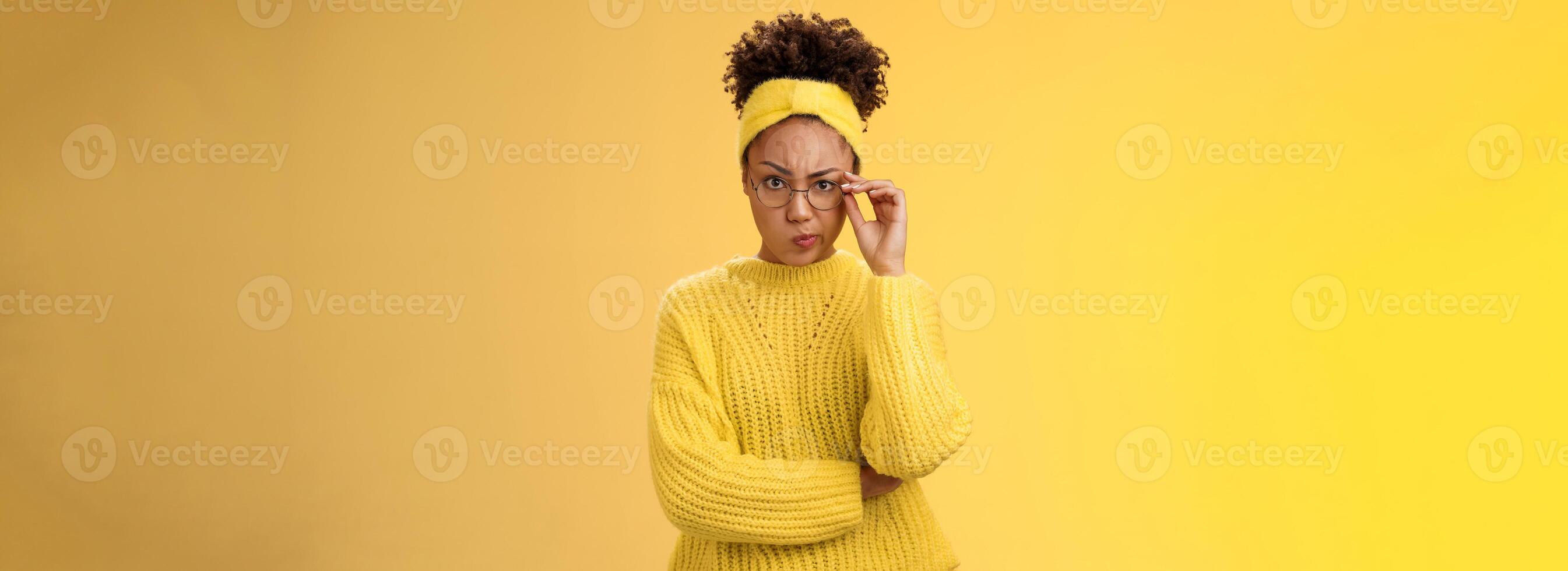 Suspicious strict serious-looking attractive clever african-american female student check glasses smirking disapproval frowning displeased bad classmate behaviour standing doubtful look disbelief photo
