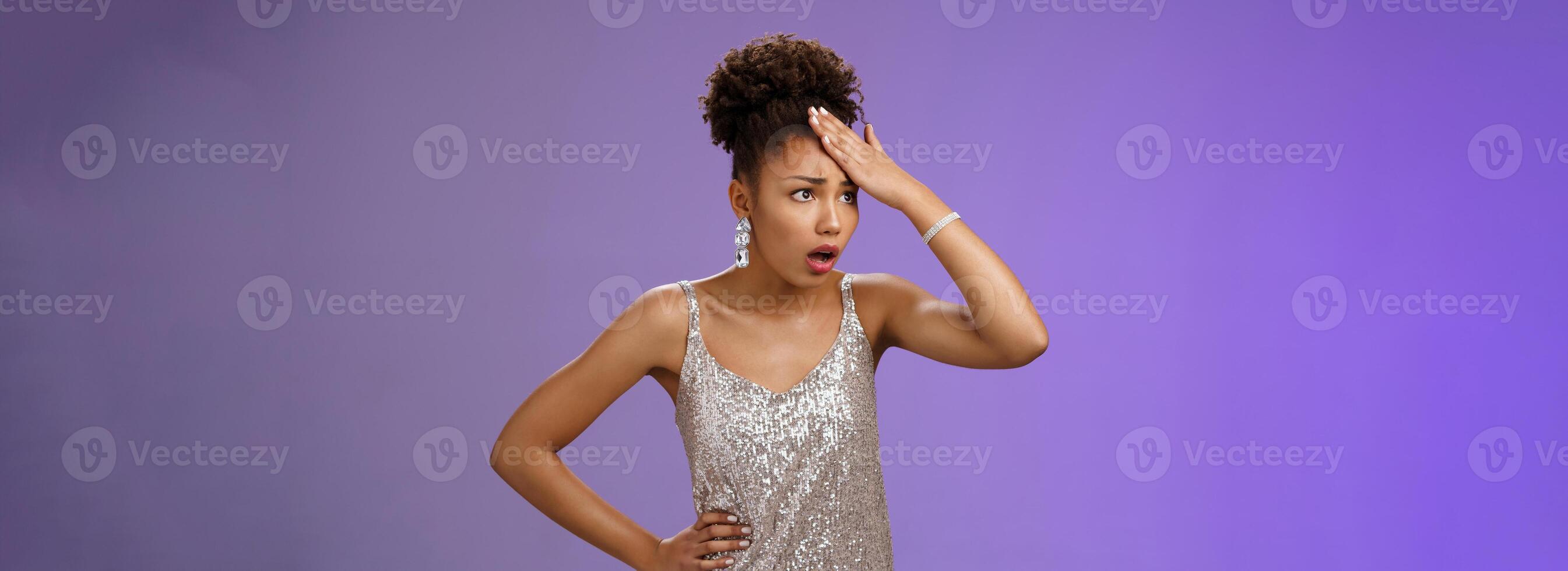 Annoyed arrogant african-american wealthy woman in silver shiny dress irritated bothered stupid servants punch forehead pissed fed up gasping fed up look aside, hear ridiculous story, blue background photo