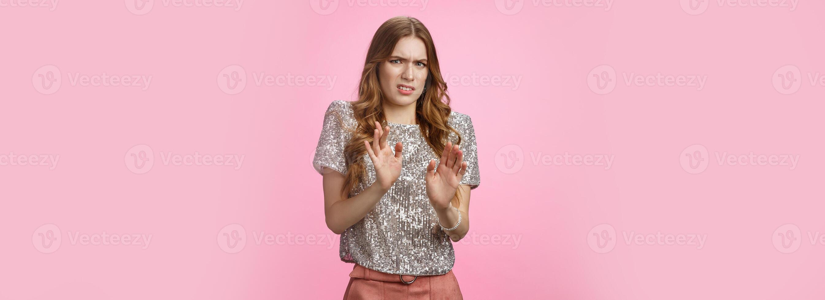 No thanks pass. Arrogant picky snobbish attractive glamour european woman partying refusal clingy man offer raise hands rejection aversion, frowning cringing disgust, standing pink background photo