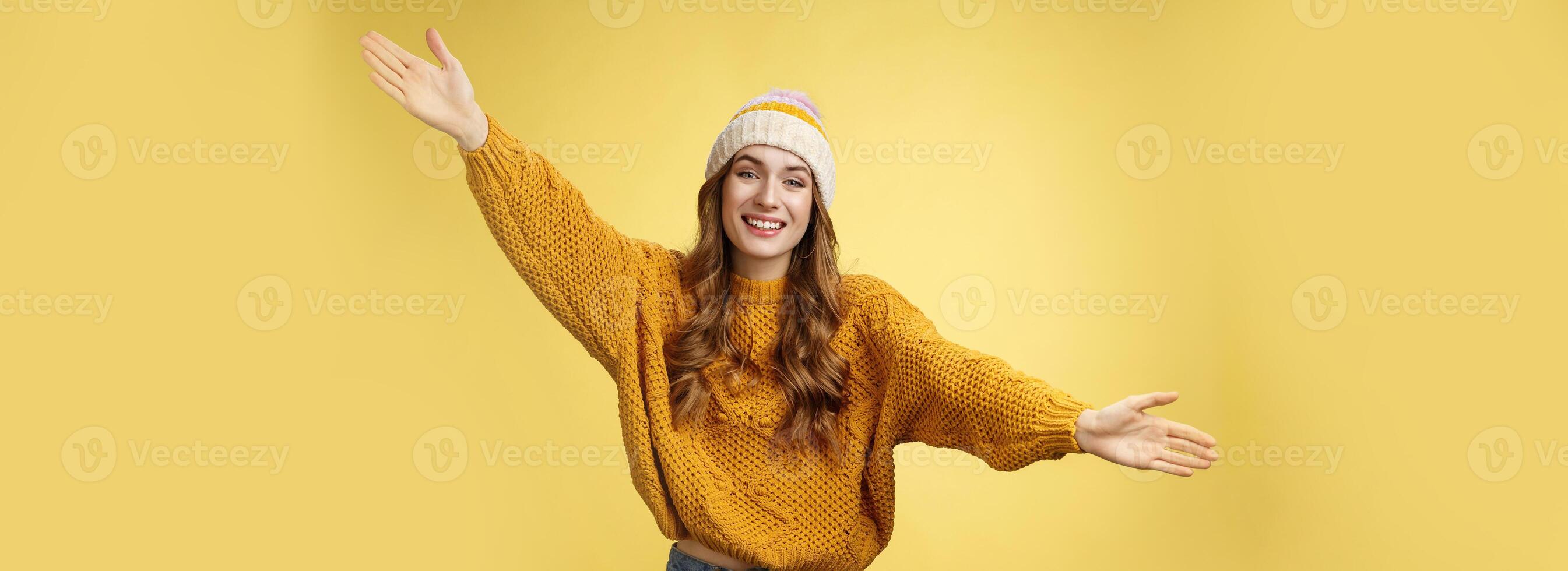 Friendly happy charming smiling cute girl inviting friends joyfully spread hands embracing wanna hug cuddle dear guest grinning cheerful, having fun expressing postivity good mood photo