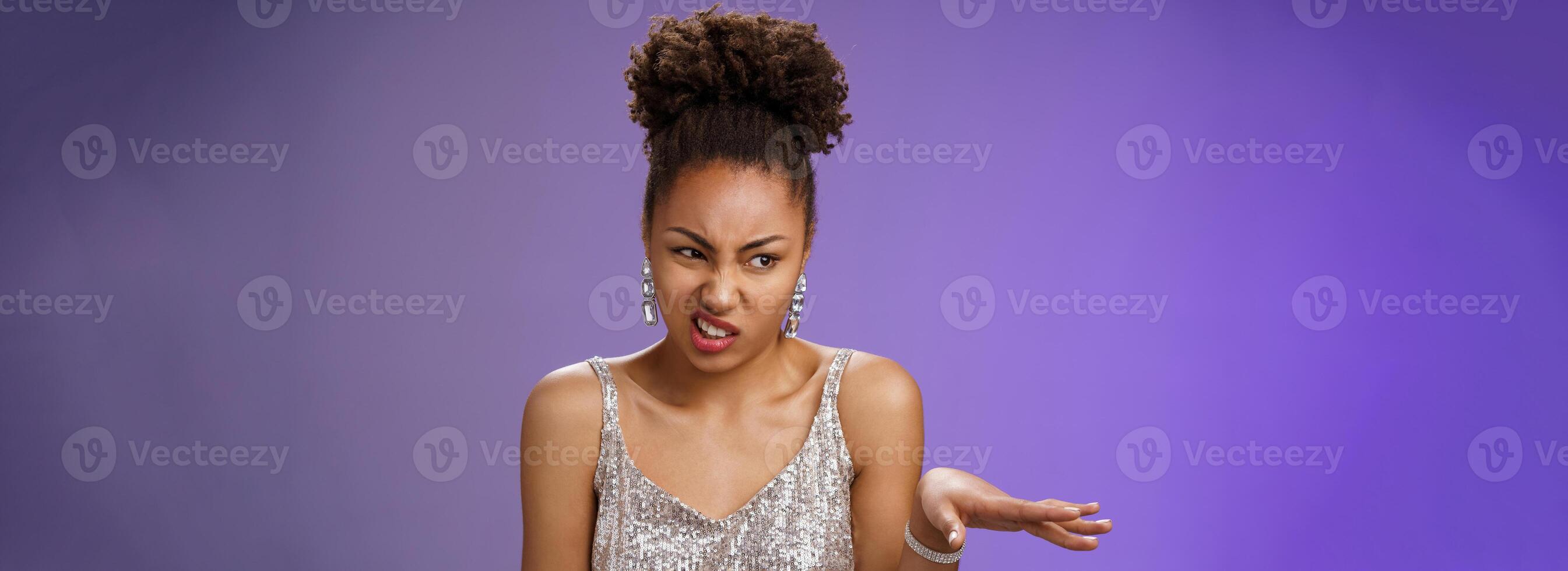 Arrogant peeky african-american woman in shiny luxurious dress cringing aversion wave away dislike aversion expressing disgust contempt speaking reluctant disappointed, grimacing photo
