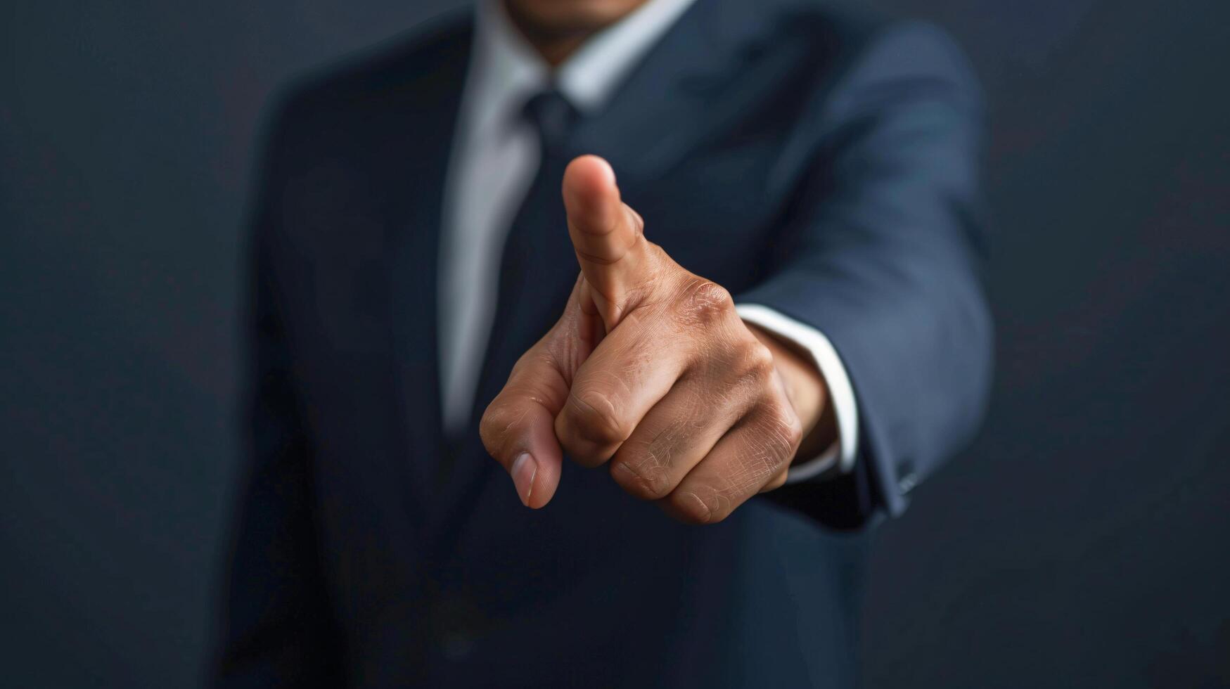 Businessman pointing pressing virtual button with his finger to touch the screen photo