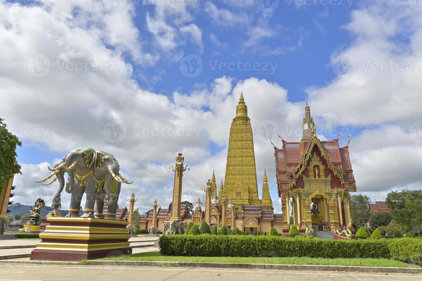 Wat Mahathat Wachiramongkhon or Wat Bang Thong, Krabi Province, Thailand. Beautiful scenery with exterior architecture of buddhist temple under cloudy blue sky during summer. photo