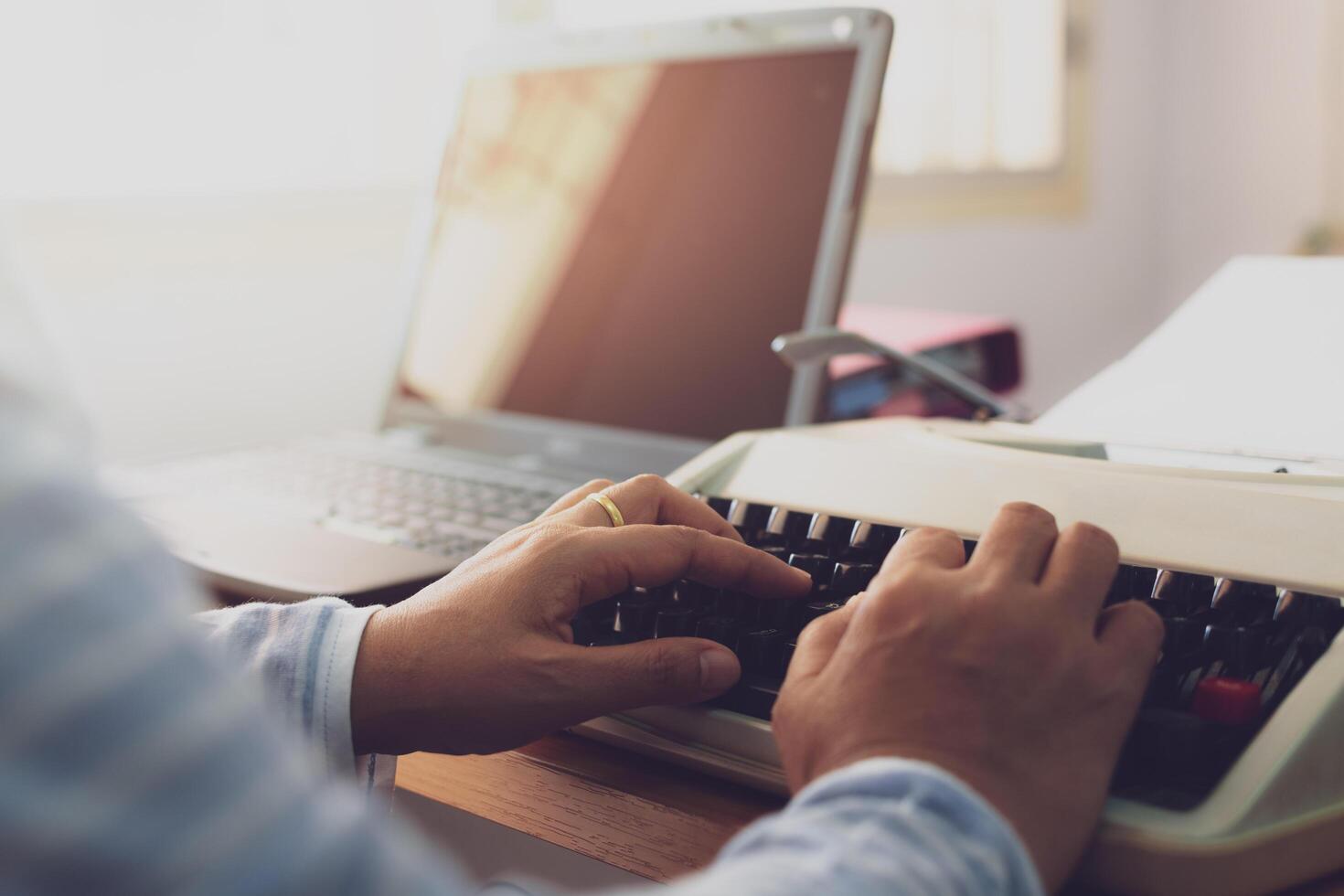 Hands of woman typing on working desk in office. photo