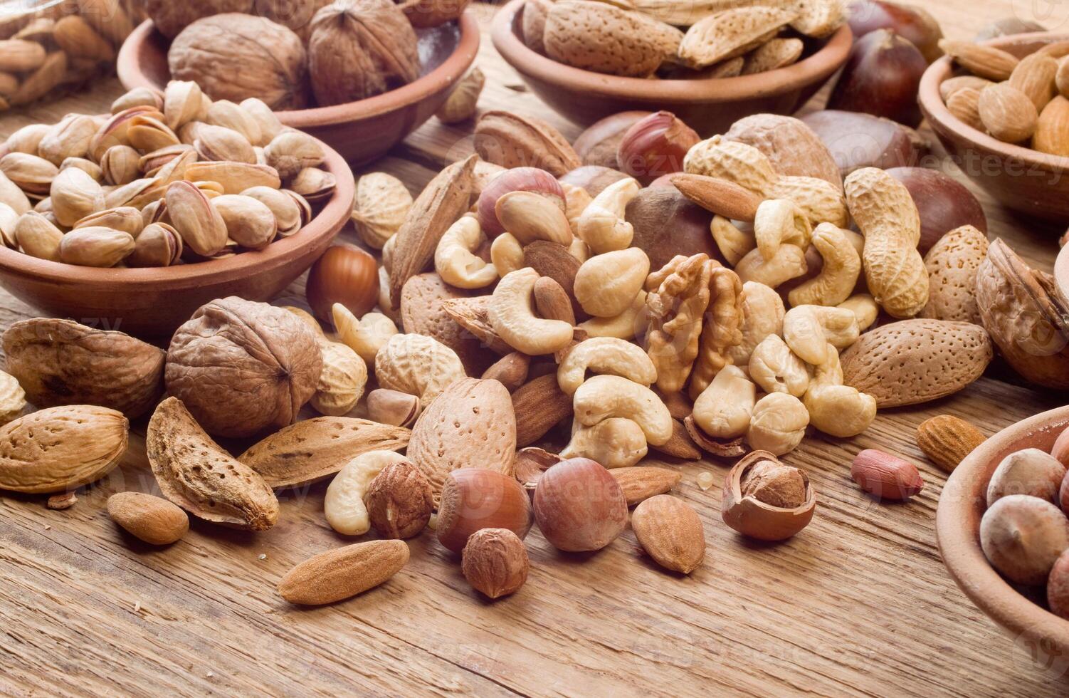 Nuts mix with wood bg photo