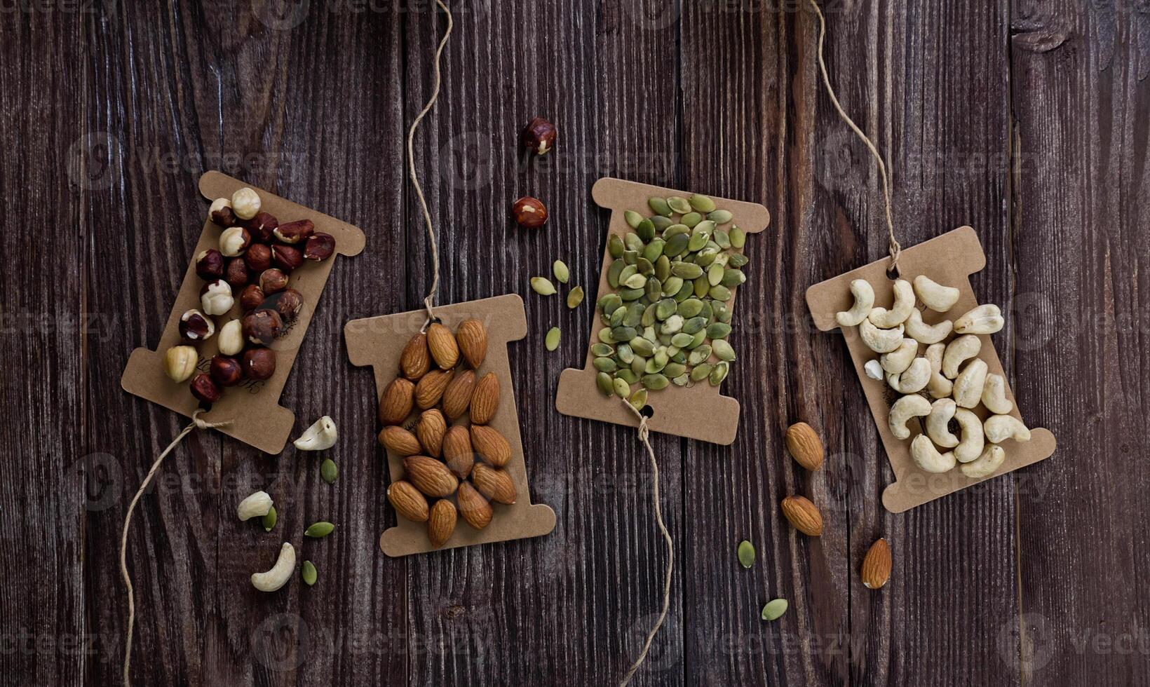 Mix nuts on wooden table,healthy vegan food. photo