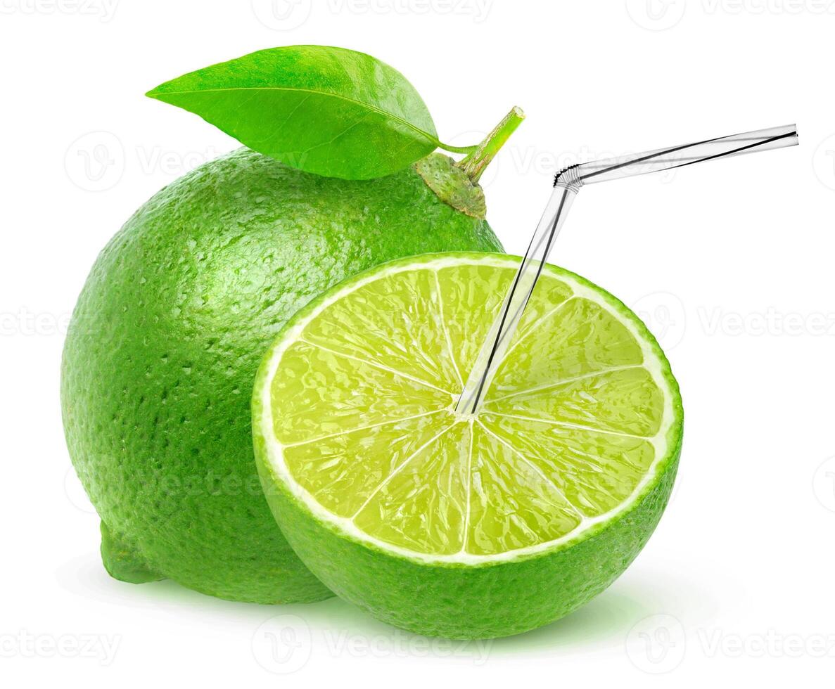 Cut lime with straw in it isolated on white background with clipping path, a natural fresh fruit juice concept photo