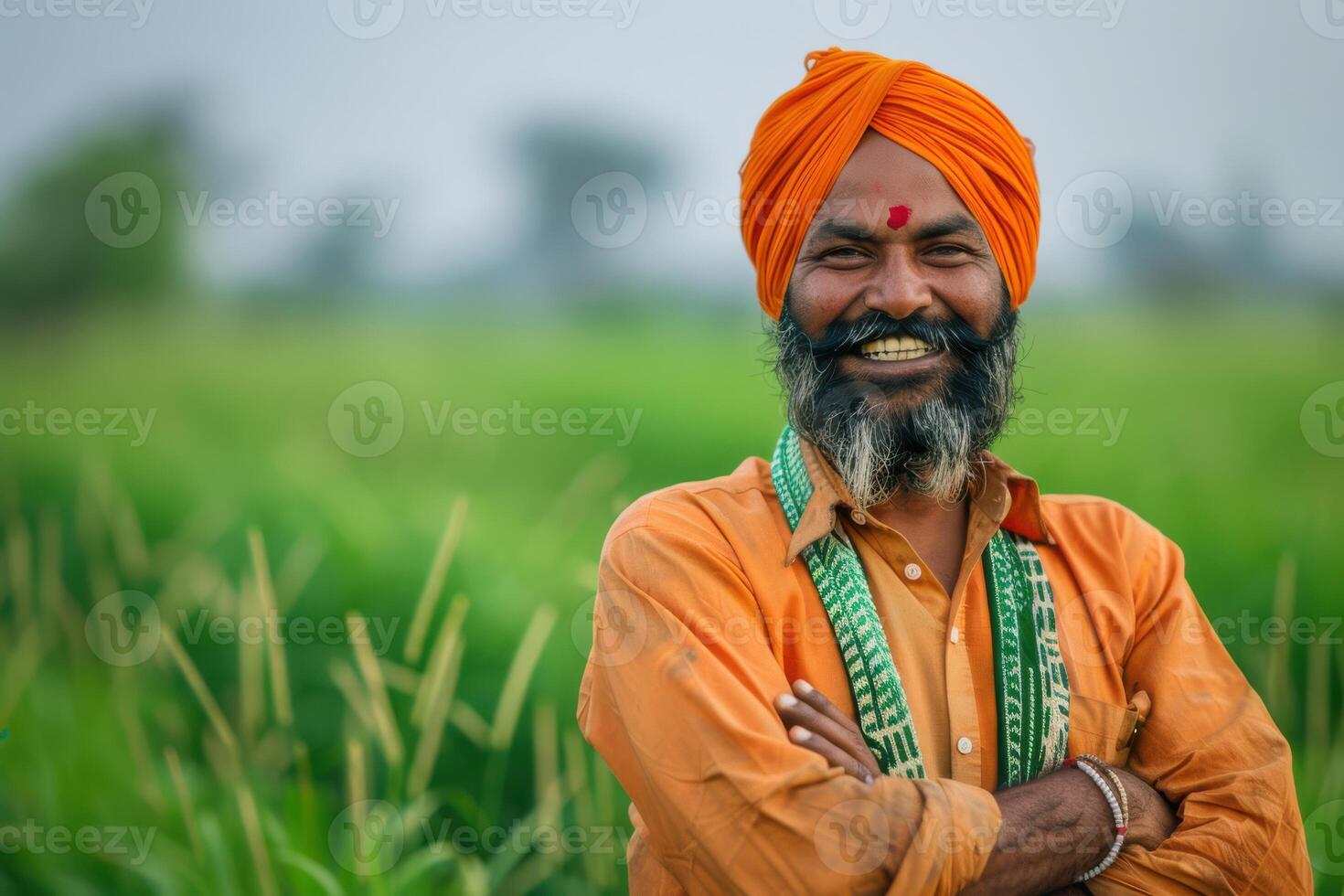 Joyful Indian Farmer Posing in a Vibrant Green Field, Embracing the Fruits of His Labor photo