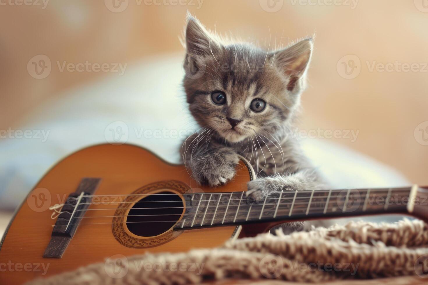 Cute Kitten Engaged with a Guitar, Capturing a Fun and Playful Scene Full of Joy photo