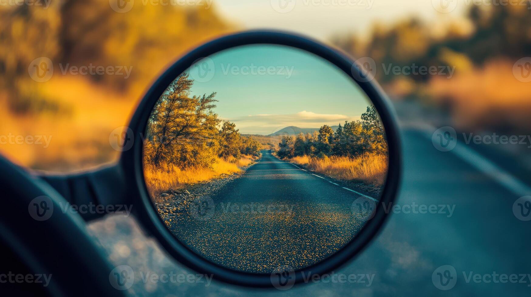Mirror reflection on the road, capturing a view of the surroundings. photo
