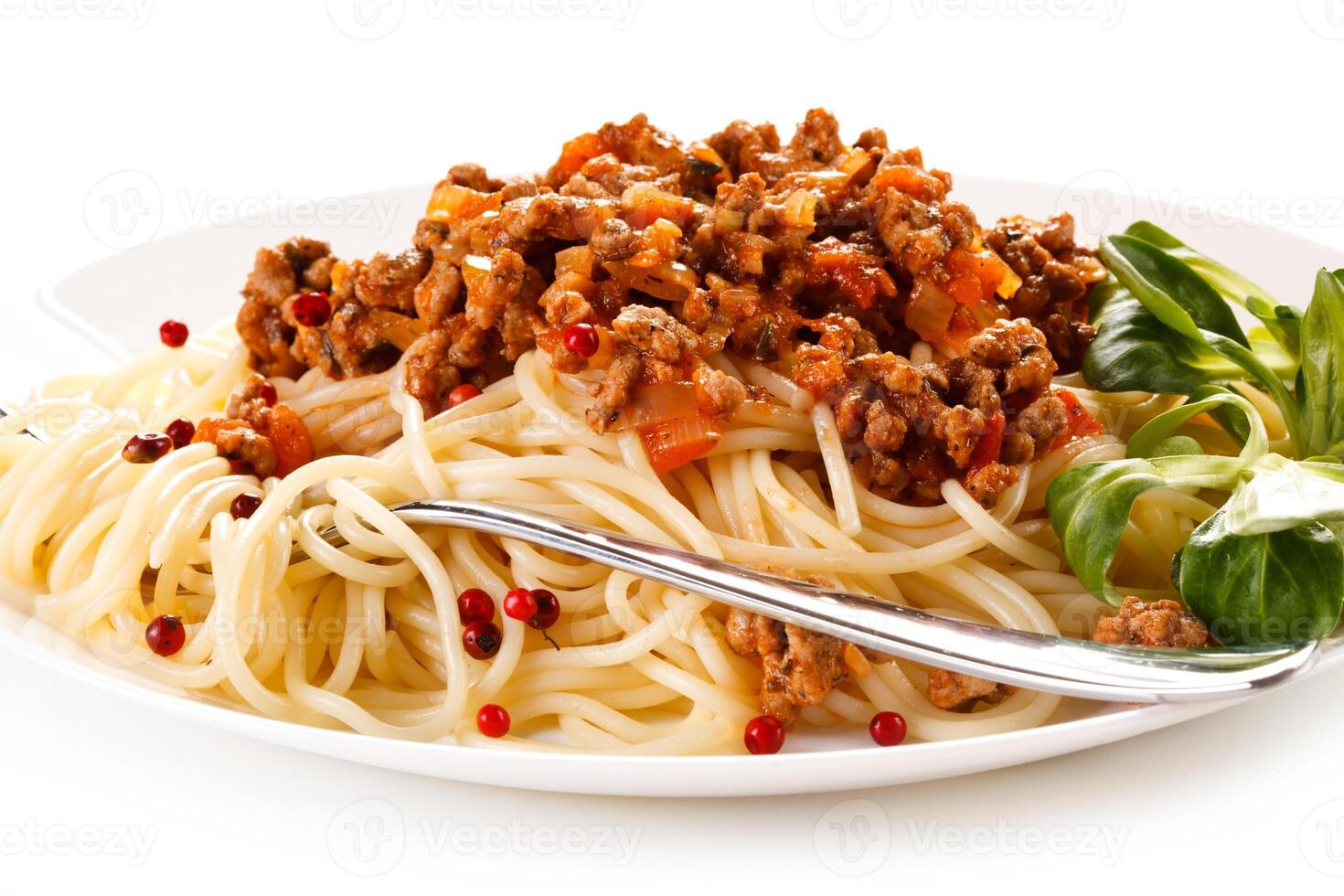 Pasta with meat, tomato sauce and vegetables on white background photo