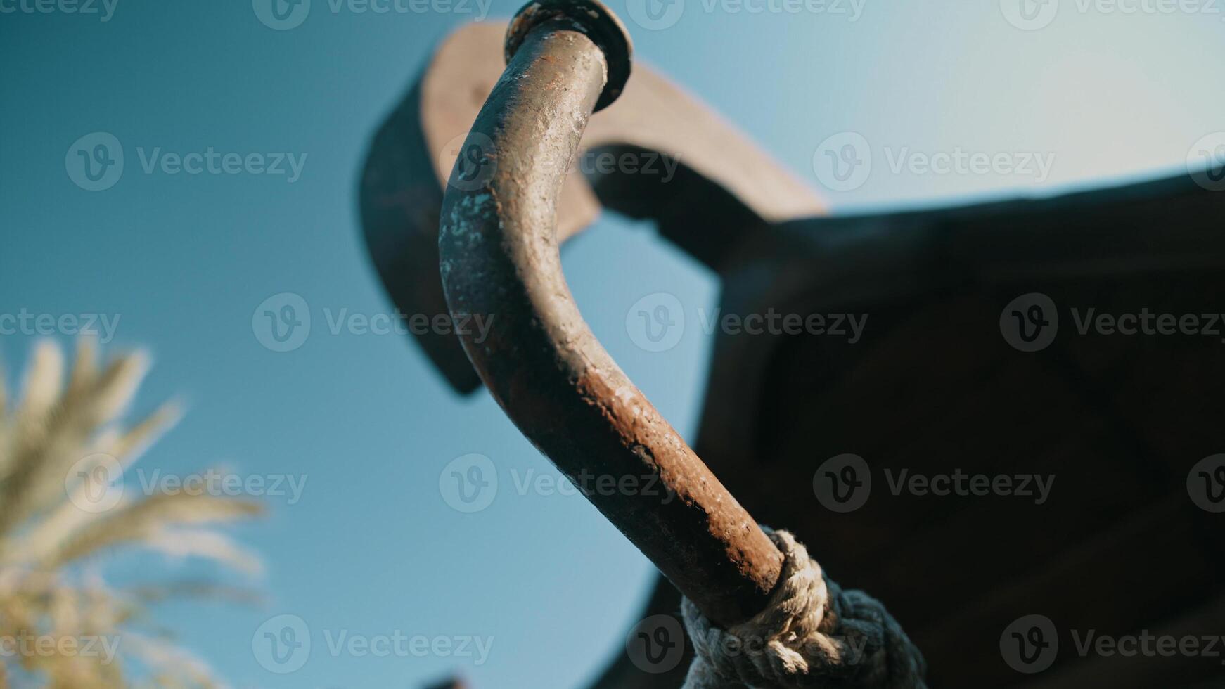 A rusty metal pipe with a small object on it photo
