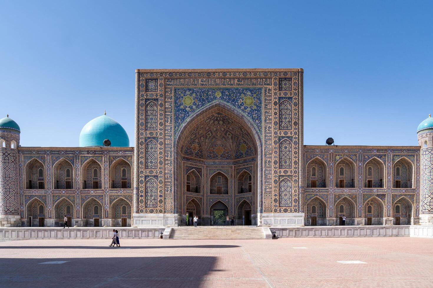 Samarkand, Uzbekistan-august 12, 2023-People visit the Registan square during a sunny day photo