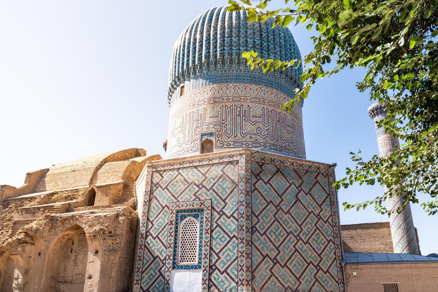 Tashkent, Uzbekistan-august 12, 2023-view of the Tamerlane Mausoleum with decorated tombs, mosaics and carvings during a sunny day photo