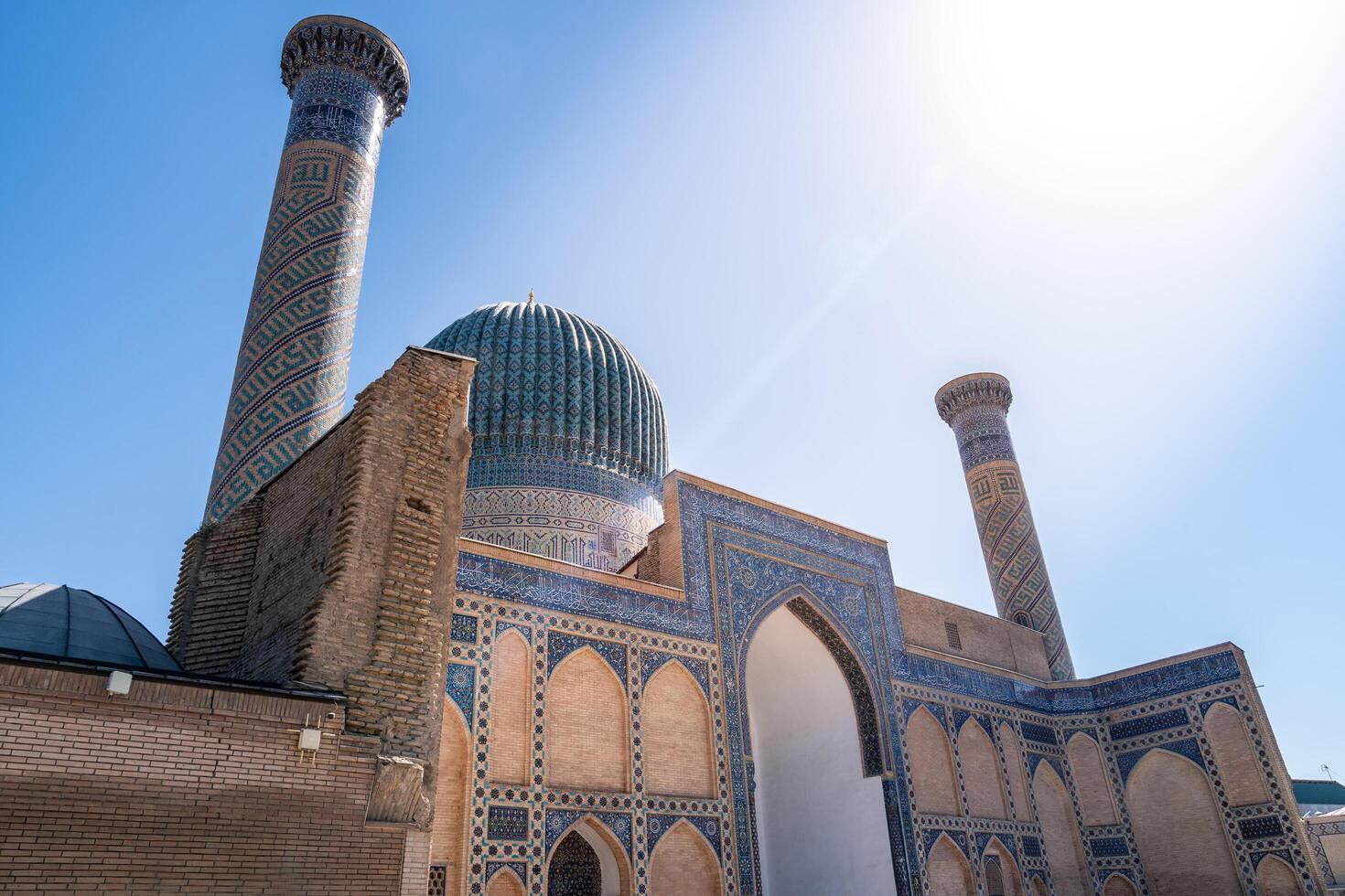 Tashkent, Uzbekistan-august 12, 2023-view of the Tamerlane Mausoleum with decorated tombs, mosaics and carvings during a sunny day photo