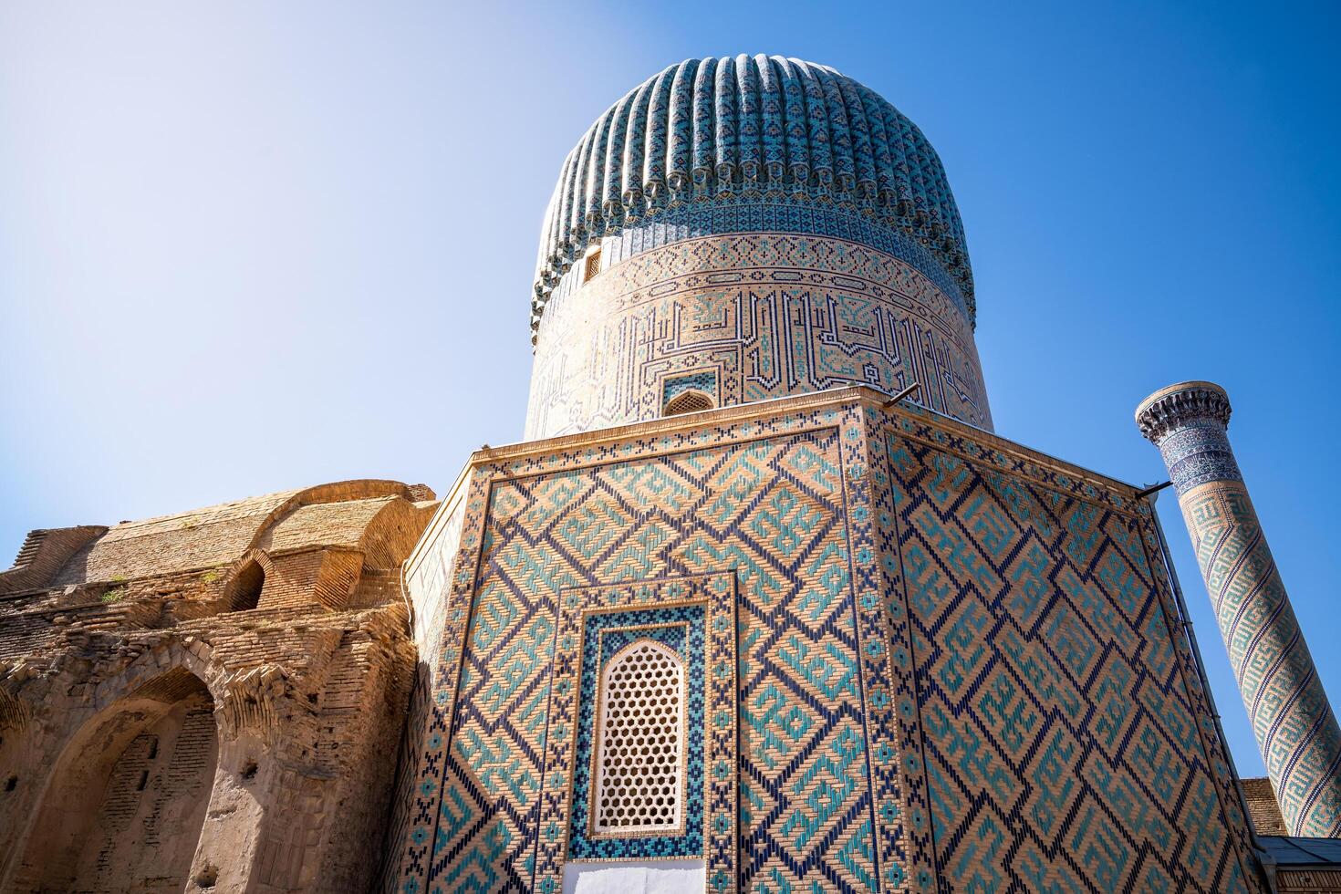 Tashkent, Uzbekistan-august 12, 2023-view of the Tamerlane Mausoleum with decorated tombs, mosaics and carvings during a sunny day photo