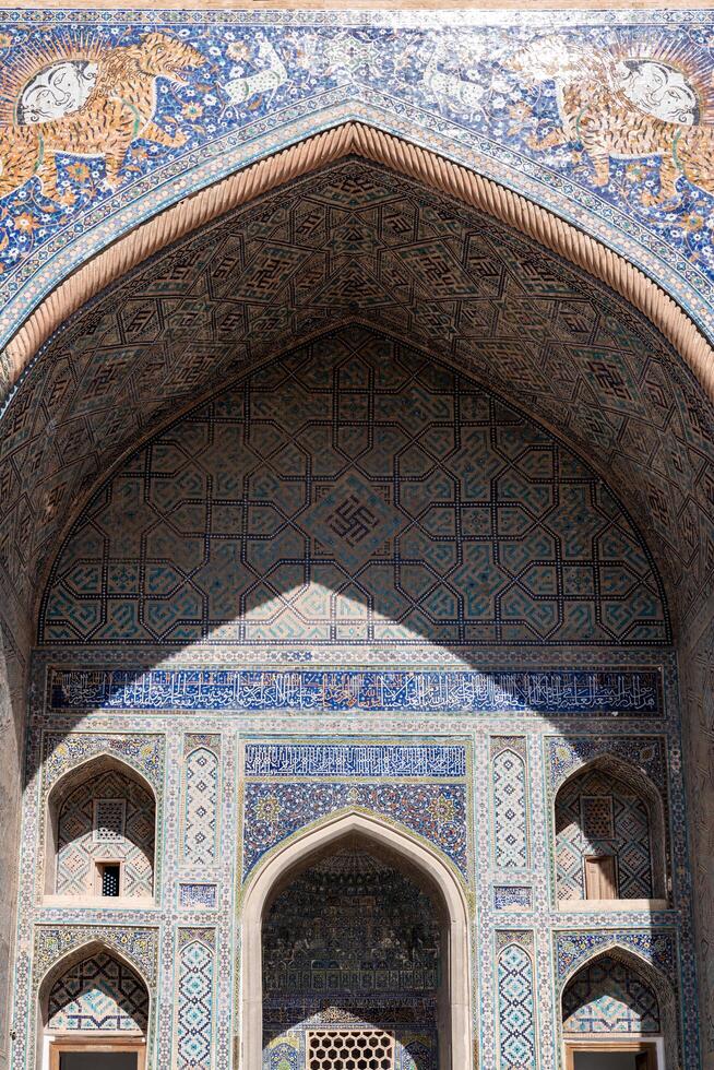 Samarkand, Uzbekistan-august 12, 2023-Particular of the Registan square during a sunny day photo
