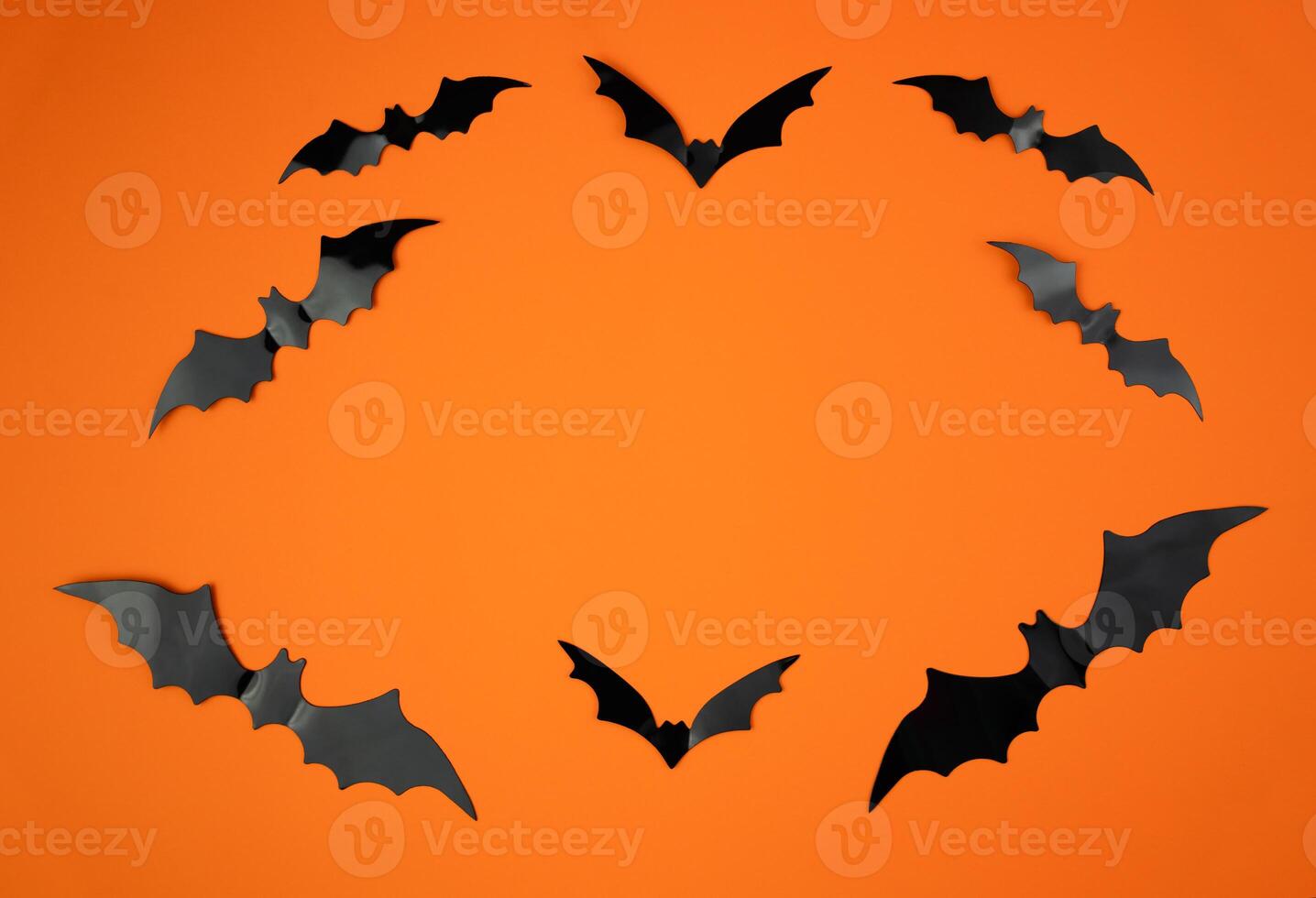 Composition for Halloween with bats on an orange background. Mockup. Flatlay. Copy space. Selective focus. photo