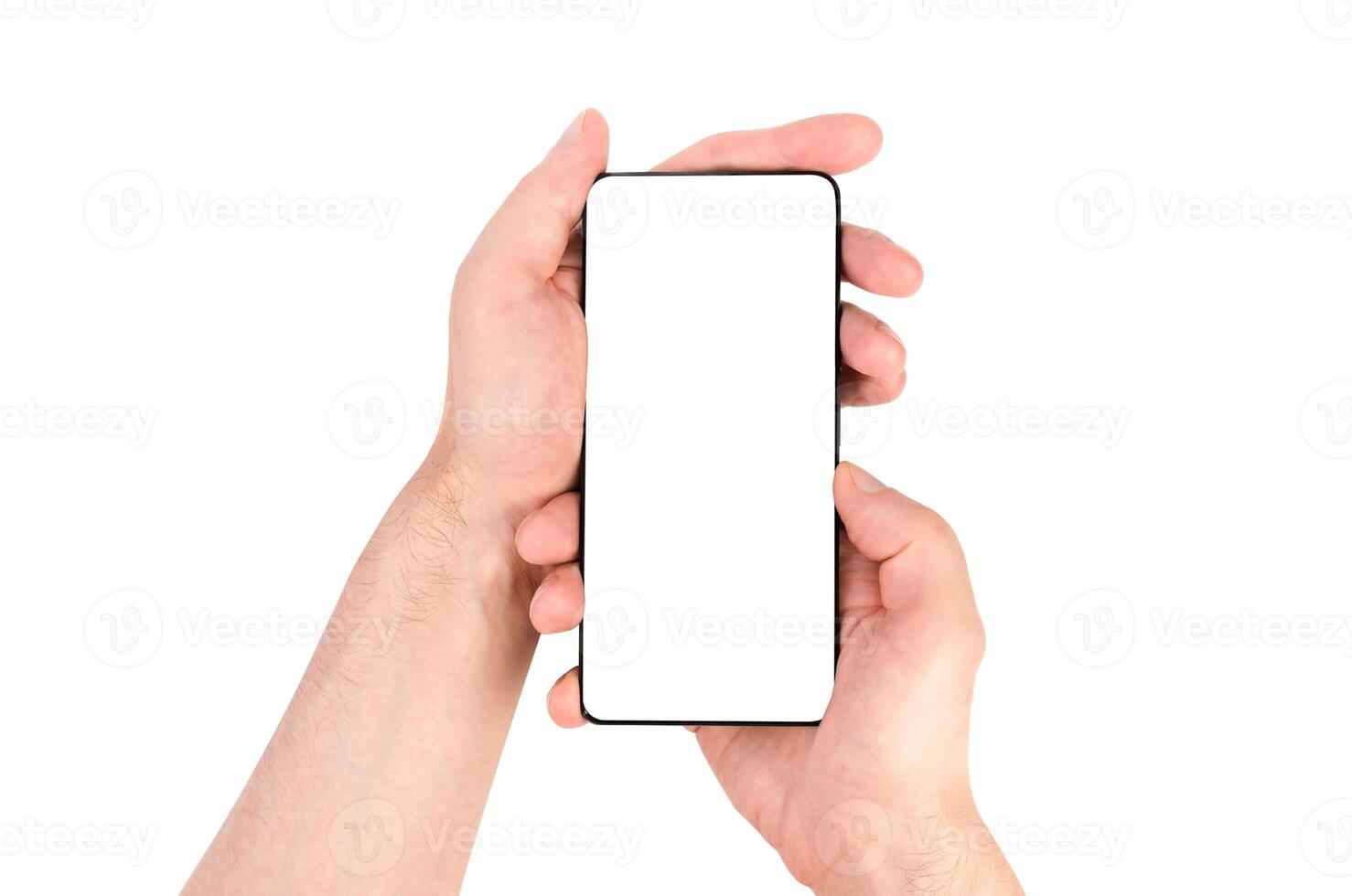 A man's hands hold a smartphone with a white screen isolated on a white background. Close-up. photo