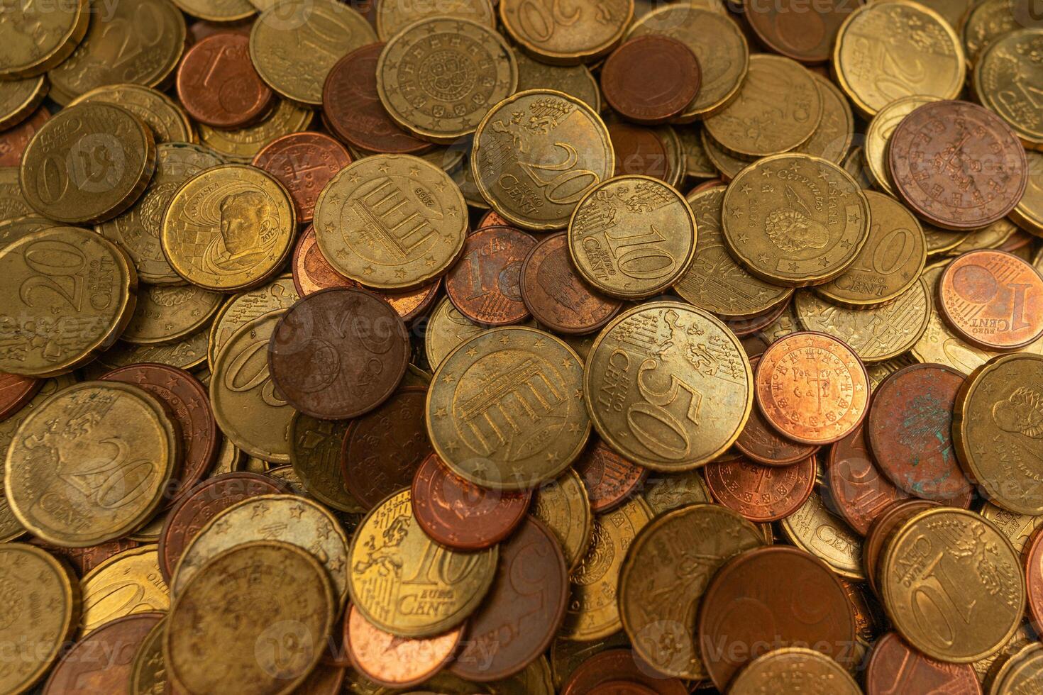 Close-up of a stack of Euro coins, showcasing detailed textures and shining surfaces. Ideal for financial and currency-related content. photo