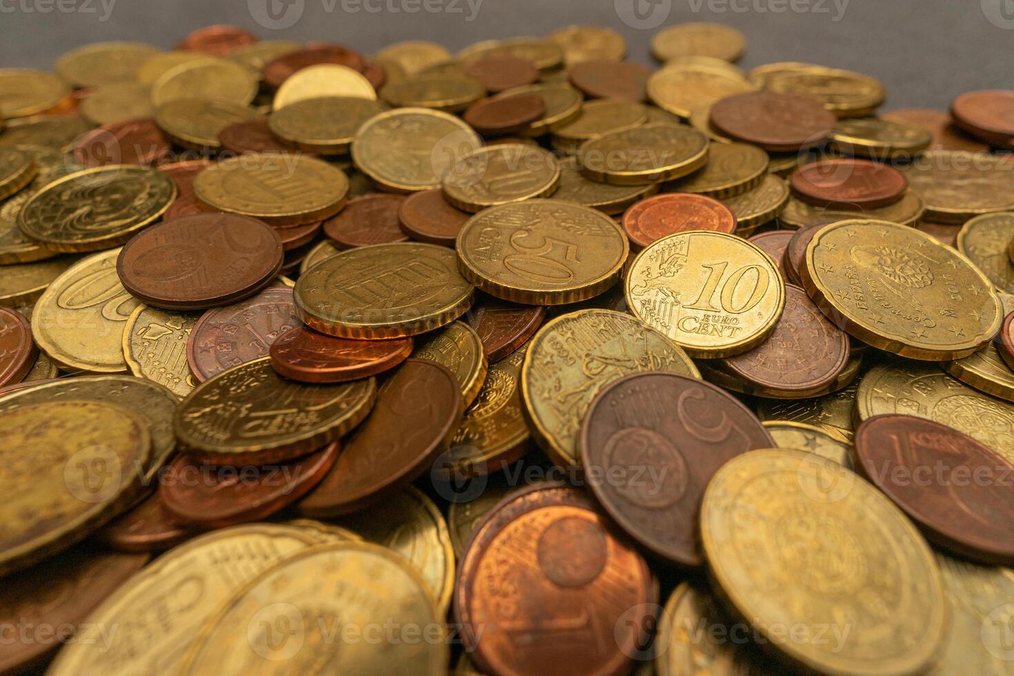 Close-up of a stack of Euro coins, showcasing detailed textures and shining surfaces. Ideal for financial and currency-related content. photo