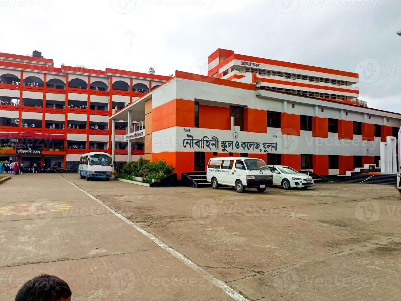 Modern School and College Complex with Glorious Orange and White Design Buildings photo