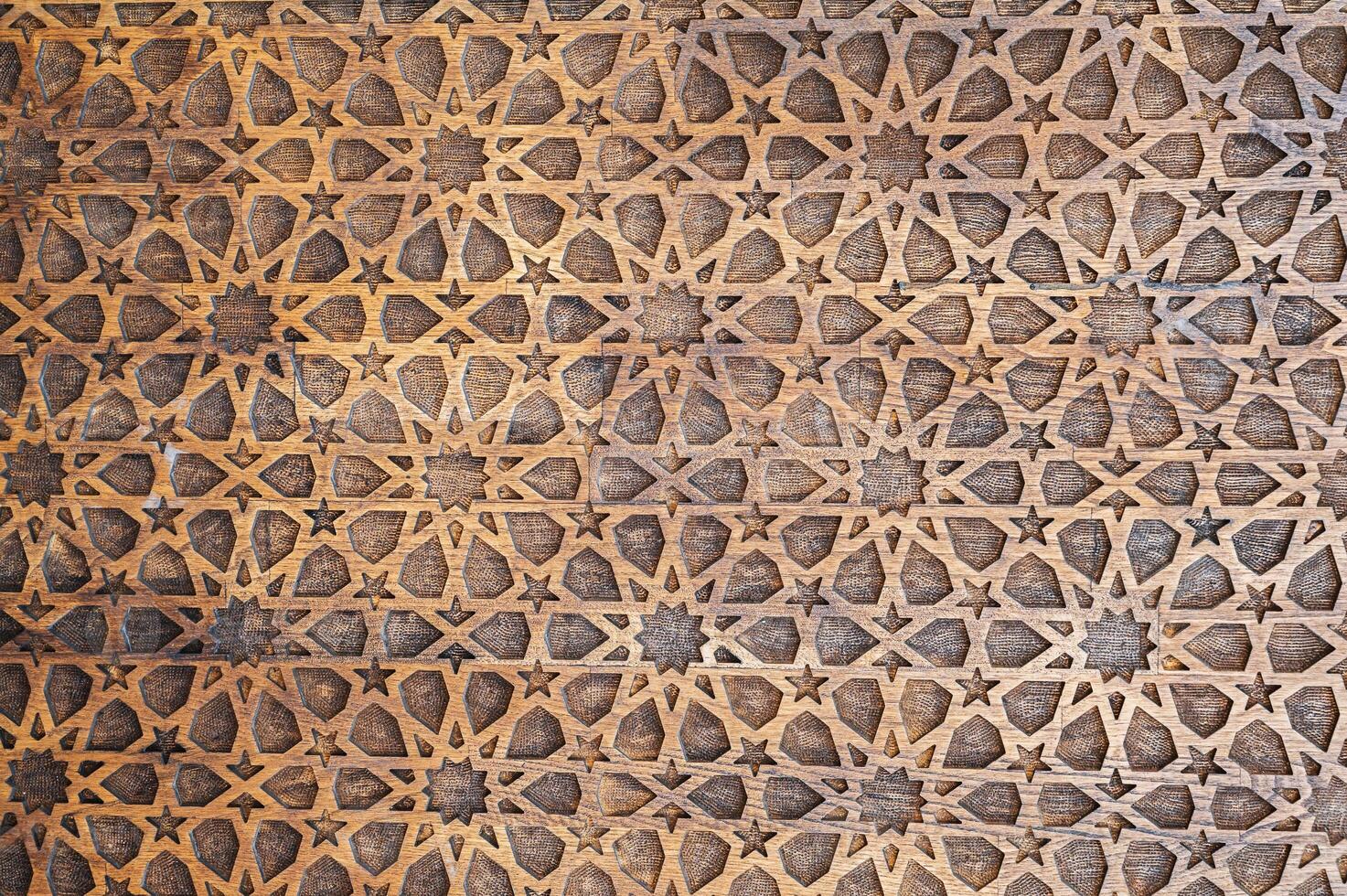 Uzbek Islamic patterns ornament with stars on a modern wooden carved door in Uzbekistan close up photo
