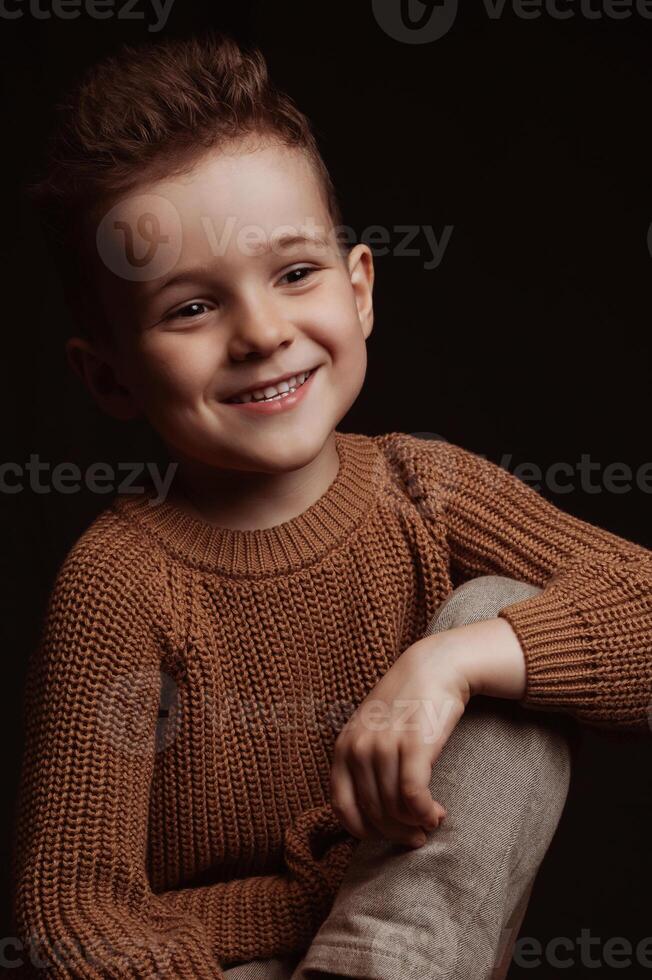 Portrait of happy smiling stylish white caucasian child boy kid preschooler photo