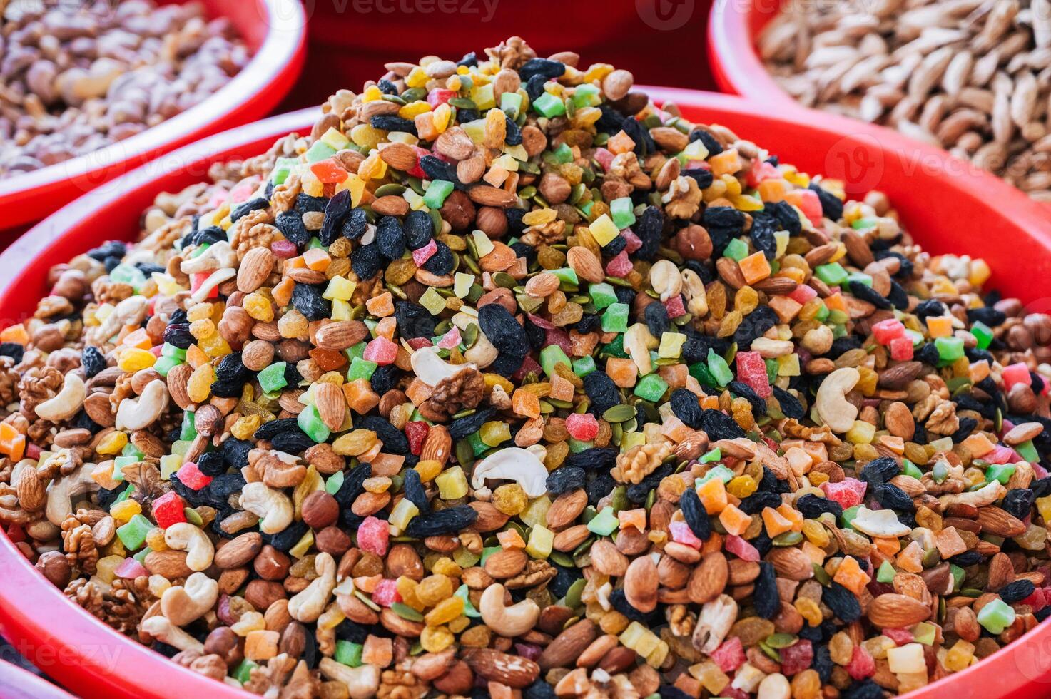 traditional Uzbek sweet mix of various varieties of nuts, dried fruits, oriental sweets close up photo