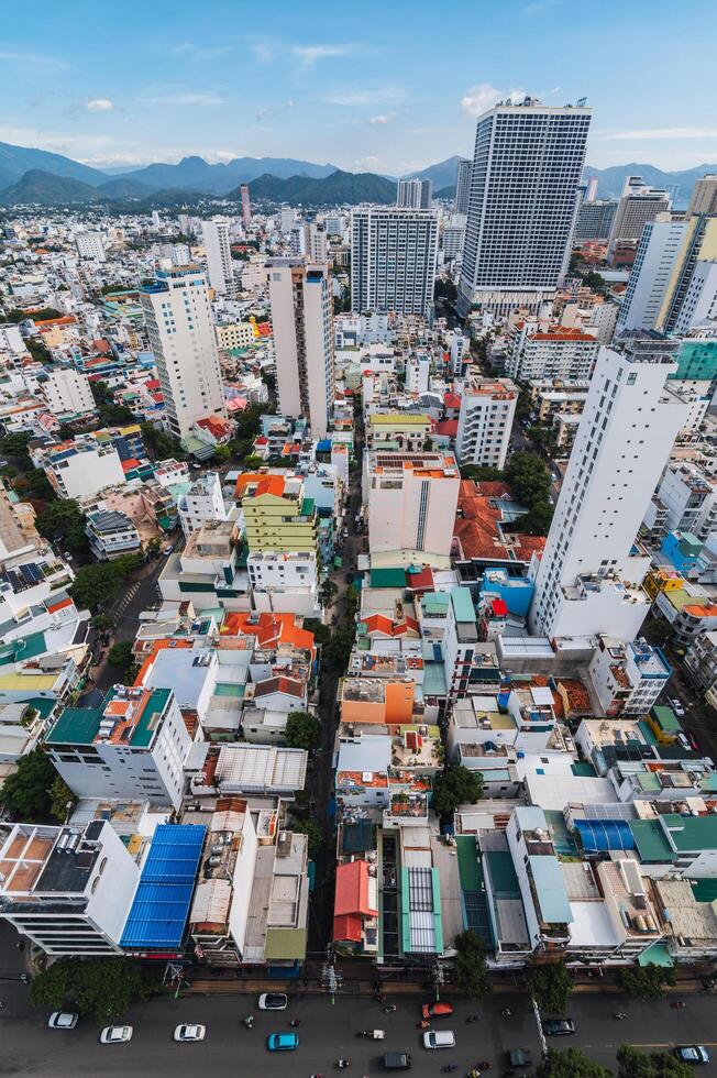 Aerial view top of the skyscrapers in center of Nha Trang city in Asia at summer day. Nha Trang, Vietnam - July 19, 2024 photo