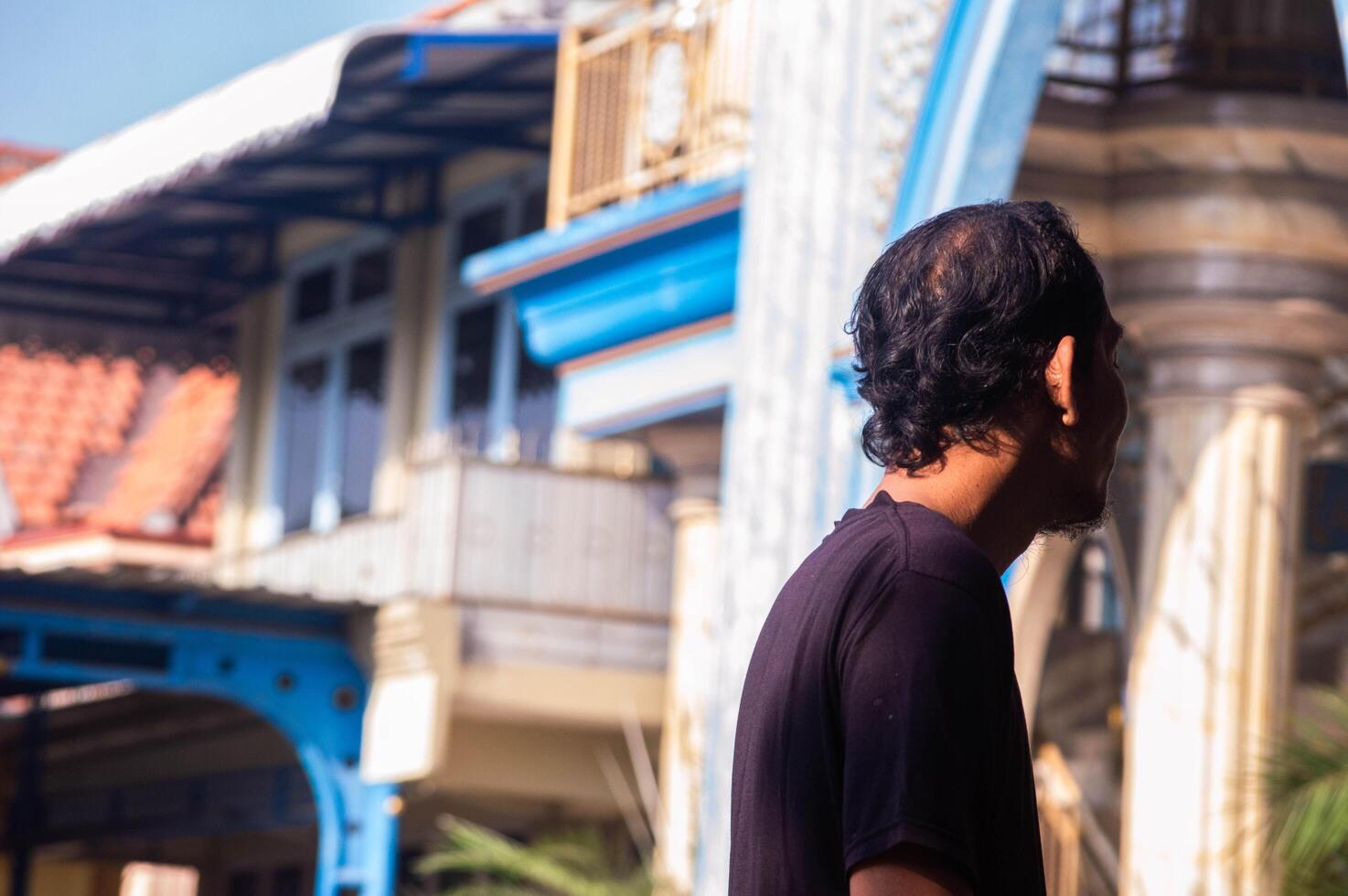 gresik, indonesia, 20 august 2023 - shot on the expression of an old indonesian man photo