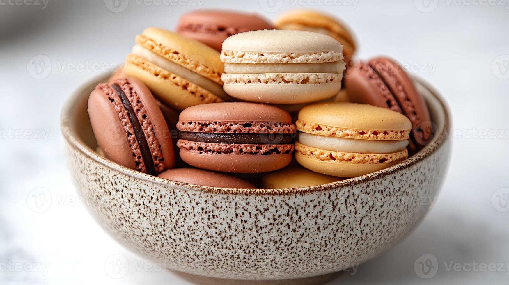A bowl filled with assorted macarons, showcasing a variety of colors and flavors. photo