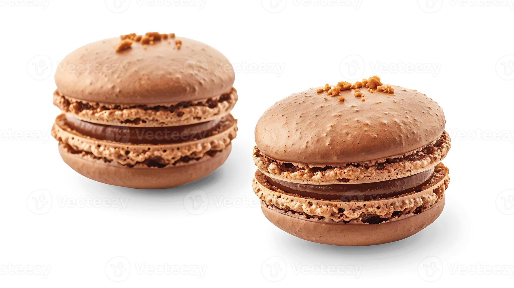 Two chocolate macarons with caramel filling and chocolate sprinkles on top. photo