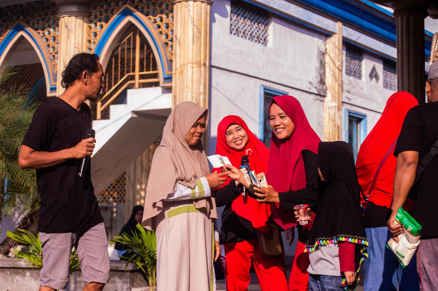Gresik, Indonesia, 20 August 2023 - Village residents who were gathering at an event in the community area. photo