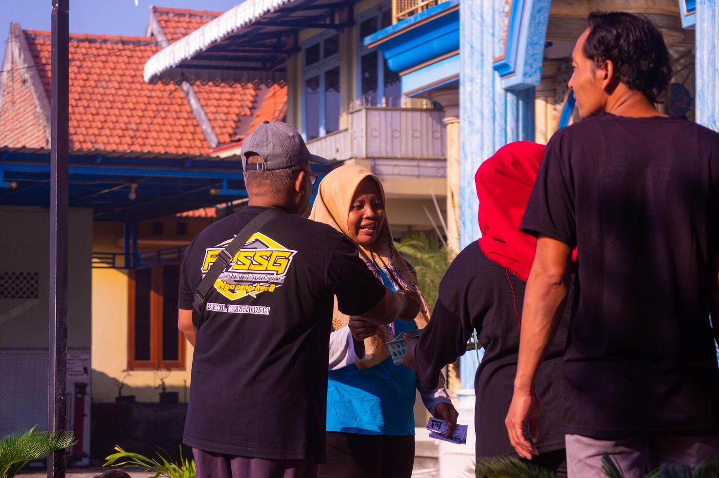 Gresik, Indonesia, 20 August 2023 - shot on Indonesian people's expressions when receiving gifts during Independence Day celebrations in Indonesian circles. photo