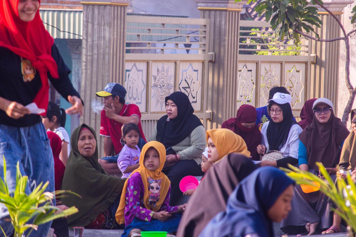 Gresik, Indonesia, 20 August 2023 - Village residents who were gathering at an event in the community area. photo