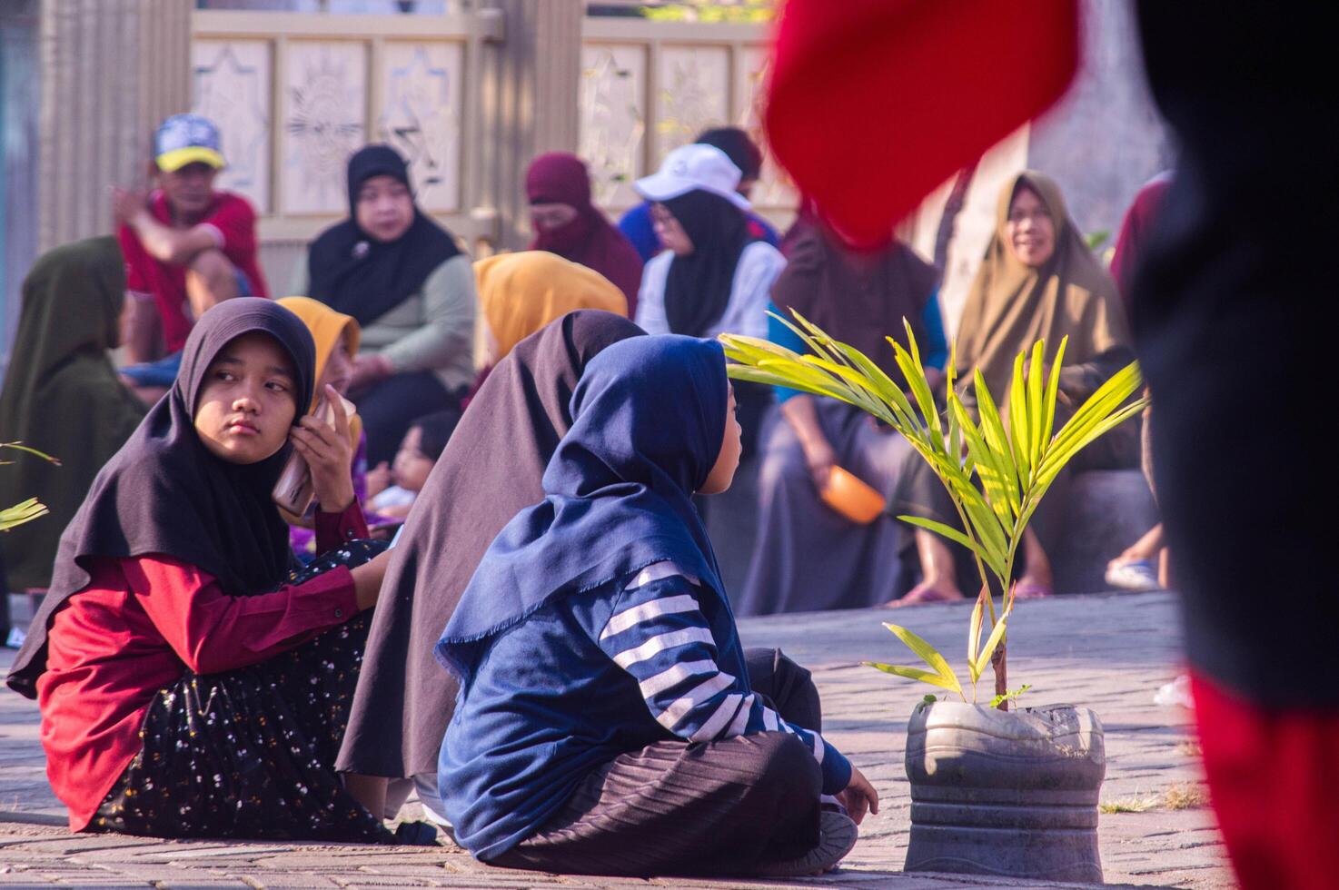 Gresik, Indonesia, 20 August 2023 - Village residents who were gathering at an event in the community area. photo
