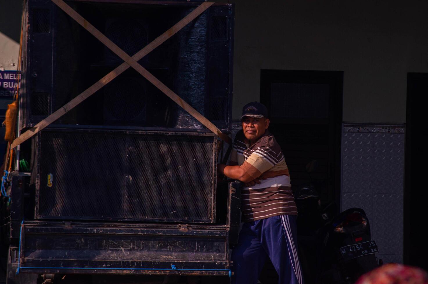 gresik, indonesia, 20 august 2023 - shot on the expression of an old indonesian man photo