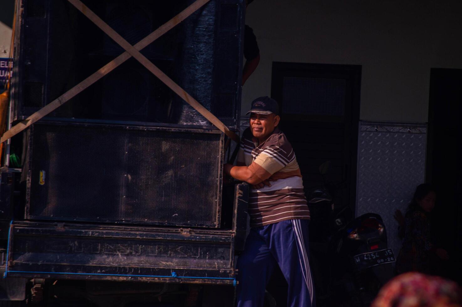 Gresik, Indonesia, 20 August 2023 - shot on Indonesian people's expressions when receiving gifts during Independence Day celebrations in Indonesian circles. photo