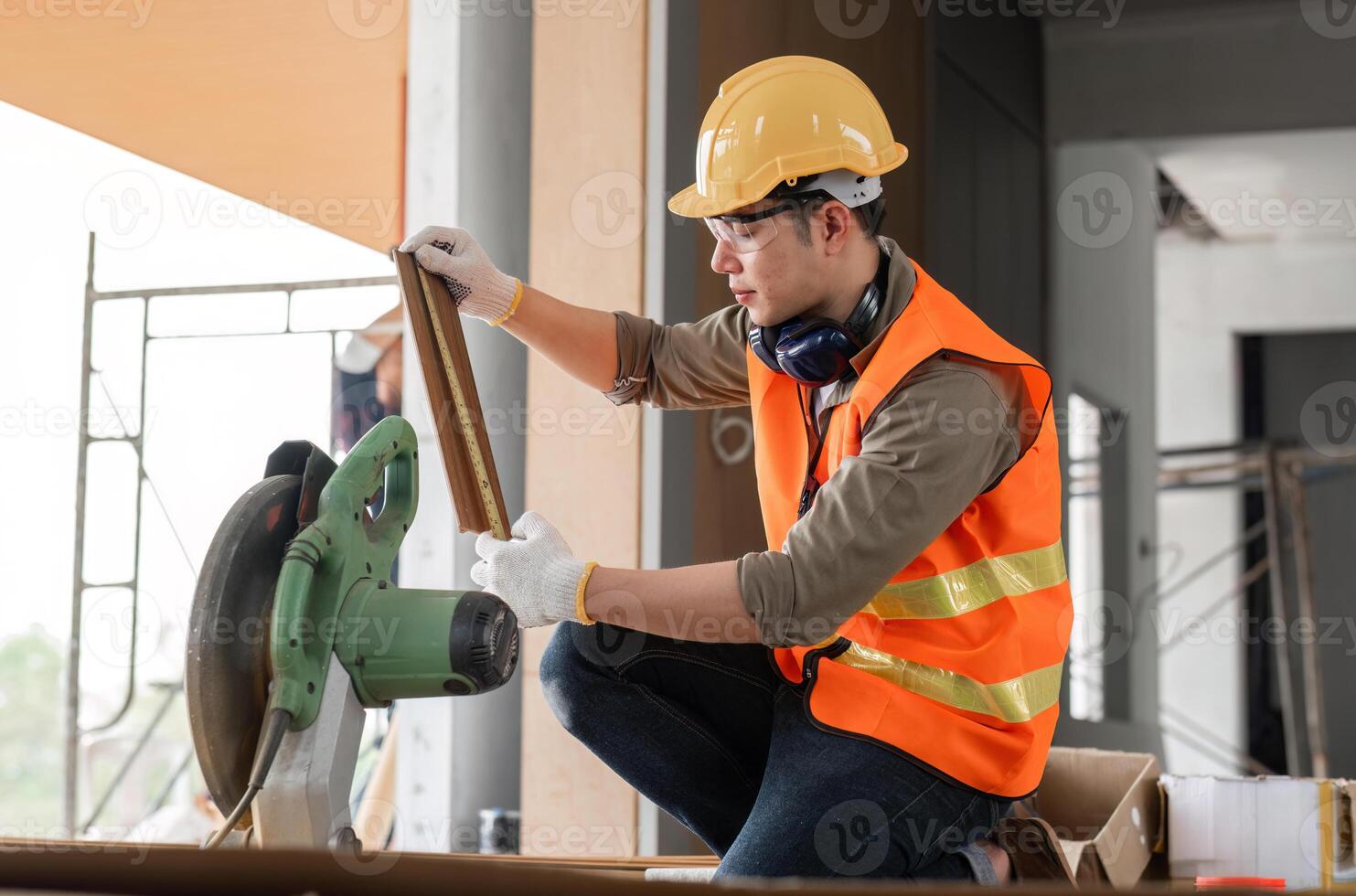 Engineer in Safety Gear Working on Construction Site with Tools and Equipment, Focused on Measurements and Precision photo