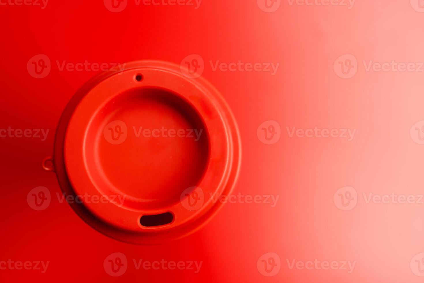 A red reusable plastic coffee cup photo