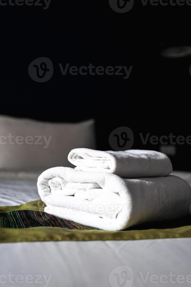 White towel on bed photo